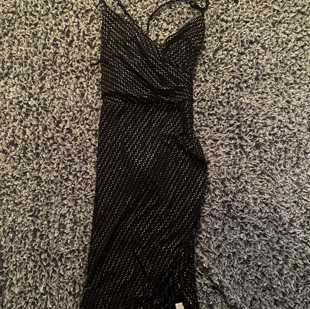 Black skin tight sparkle dress with cross strap back.
